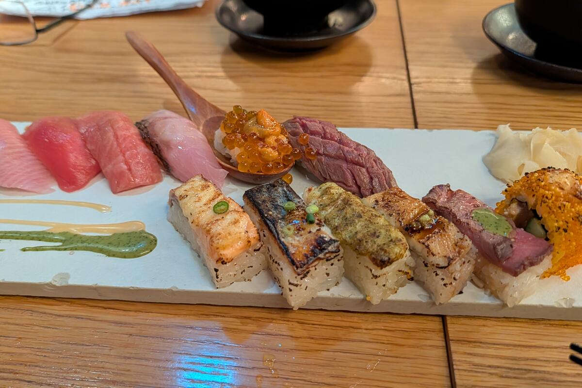 A sushi platter with assorted nigiri and rolls